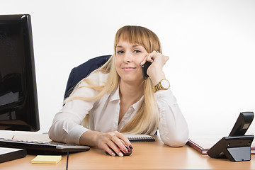 Image showing Business woman happy talking on a cell phone in the workplace