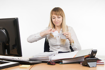 Image showing Business woman tearing paper document