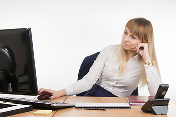 Image showing Office a specialist a little tired of working at a computer