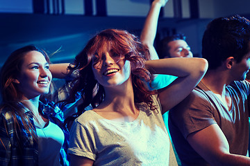 Image showing happy friends dancing at night club