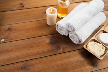 Image showing close up of natural cosmetics and bath towels