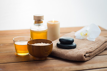 Image showing close up of salt, massage oil and bath stuff