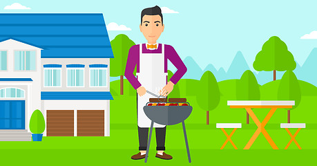 Image showing Man preparing barbecue.