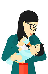 Image showing Woman feeding baby.