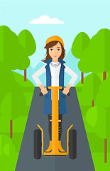 Image showing Woman riding on electric scooter.