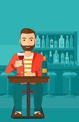 Image showing Man sitting at bar.