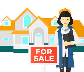 Image showing Real estate agent offering house.