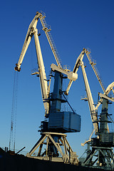 Image showing Image of an industrial port large cranes against blue sky