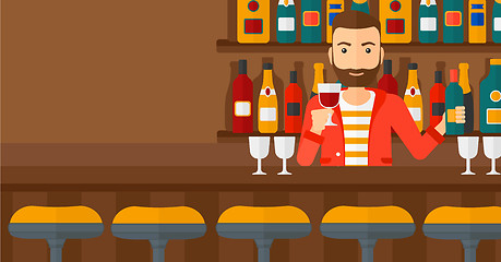 Image showing Bartender standing at the bar counter.