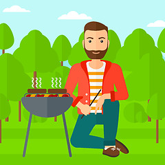 Image showing Man preparing barbecue.