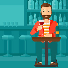 Image showing Man sitting at bar.