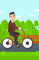 Image showing Man riding bicycle.