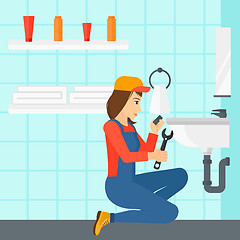 Image showing Woman repairing sink.