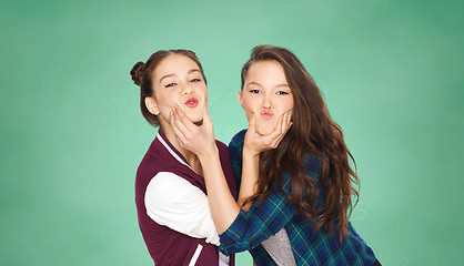 Image showing happy teenage girls having fun over green board