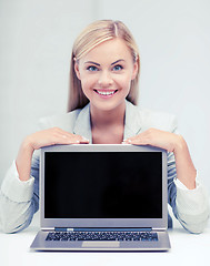 Image showing smiling woman with laptop pc