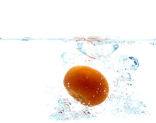 Image showing tomato falling or dipping in water with splash