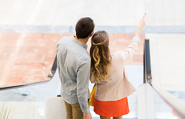 Image showing happy young couple with shopping bags in mall