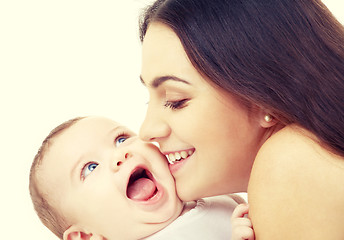 Image showing mother kissing her baby