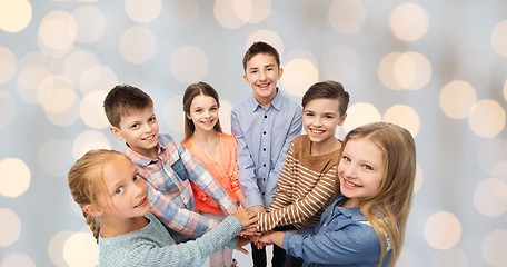 Image showing happy children with hands on top