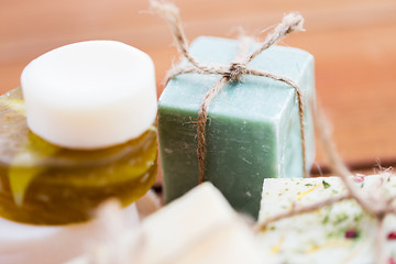 Image showing close up of handmade soap bars on wood