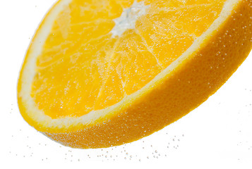 Image showing orange slice falling or dipping in water