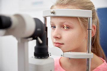 Image showing girl checking vision with tonometer at eye clinic