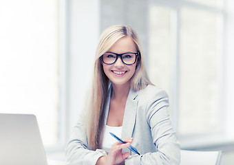 Image showing businesswoman with pen