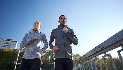 Image showing couple running outdoors