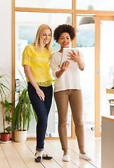 Image showing happy creative team with tablet pc in office