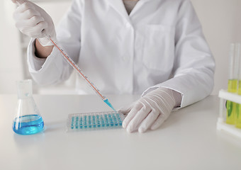 Image showing close up of scientist making test in lab