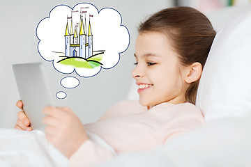 Image showing happy girl with tablet pc dreaming of fairy castle