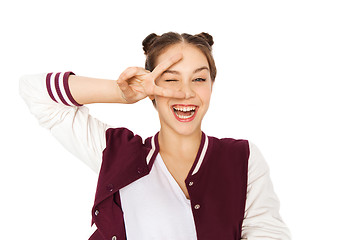 Image showing happy smiling teenage girl showing peace sign