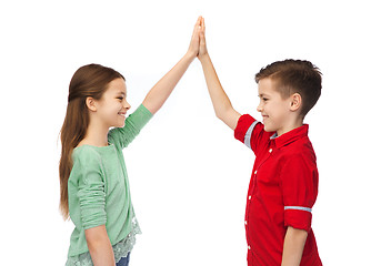 Image showing happy boy and girl making high five