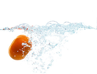 Image showing tomato falling or dipping in water with splash