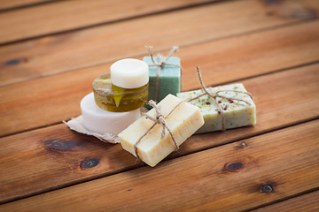 Image showing close up of handmade soap bars on wood