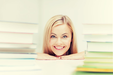 Image showing student with stack of books