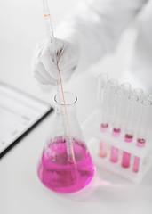 Image showing close up of scientist making test in lab