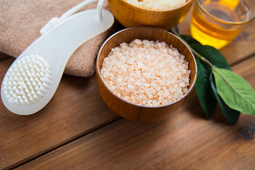 Image showing close up of himalayan pink salt with brush on wood