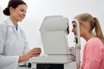 Image showing optician with tonometer and patient at eye clinic