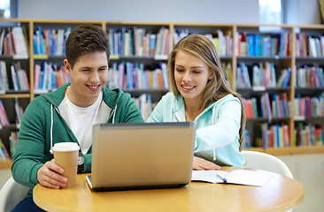 Image showing happy students with laptop in library