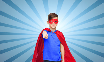 Image showing happy boy in red superhero cape and mask