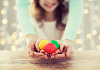 Image showing close up of happy family holding easter eggs