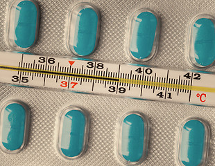 Image showing Thermometer and pills