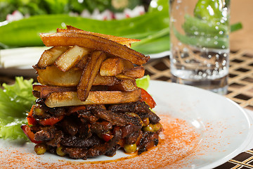 Image showing fried potatoes with meat. 