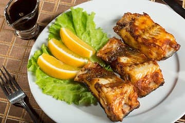 Image showing fried catfish. delicious fatty fish on a plate