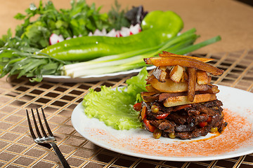 Image showing fried potatoes with meat. 