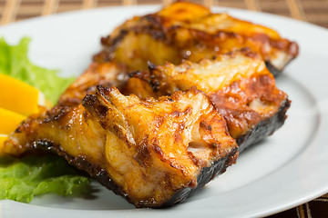 Image showing fried catfish. delicious fatty fish on a plate