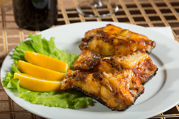 Image showing fried catfish. delicious fatty fish on a plate