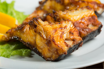 Image showing fried catfish. delicious fatty fish on a plate