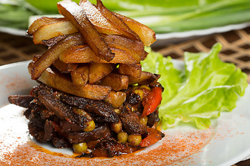 Image showing fried potatoes with meat. 